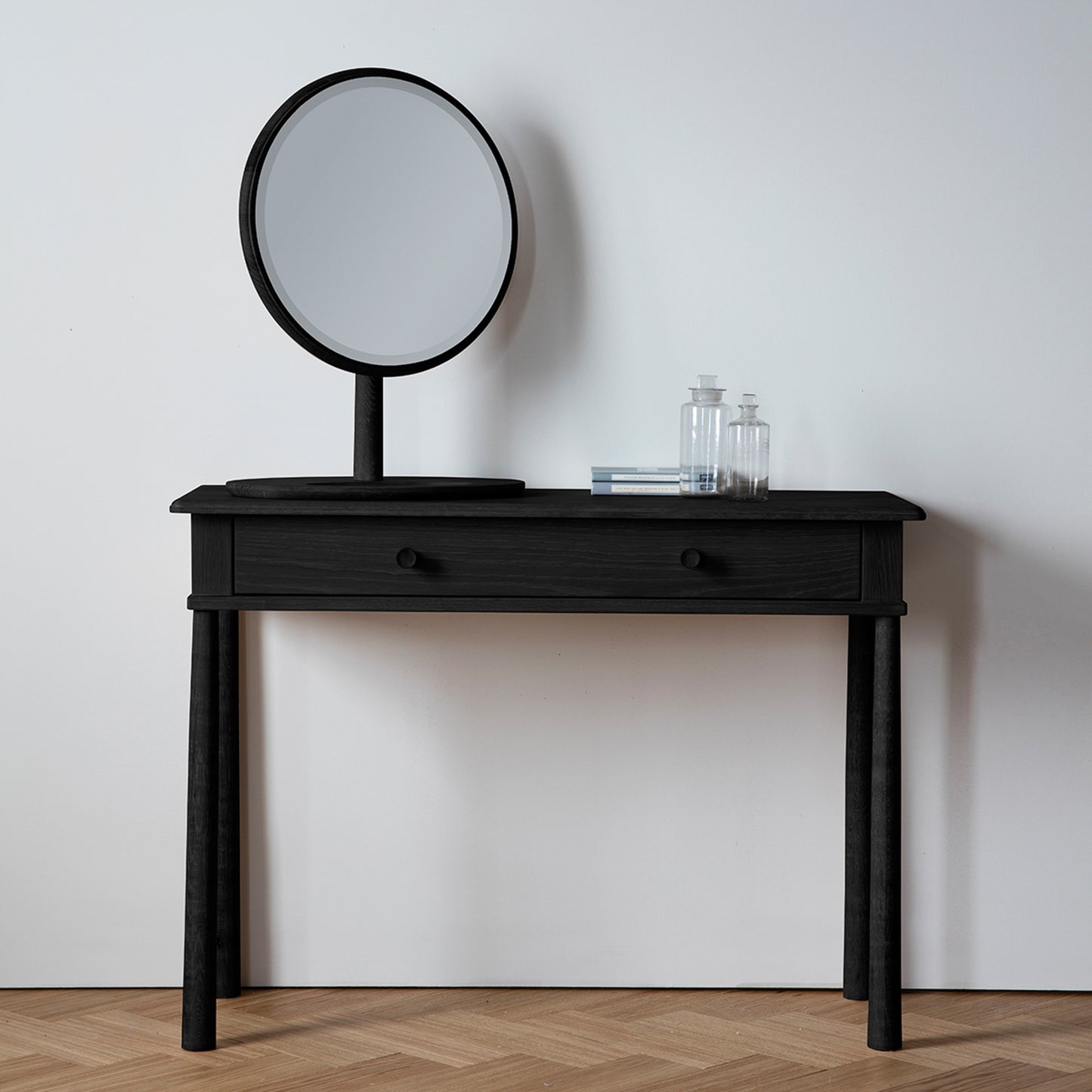 A Tigley Dressing Table with a mirror, perfect for home furniture and interior decor.