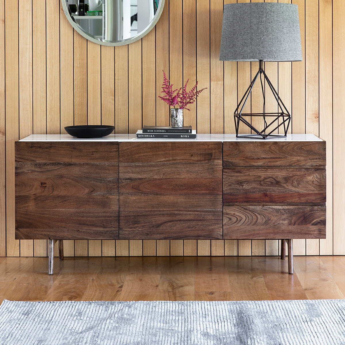 An Avonwick Sideboard 1650x450x700mm in a room with wood paneling, showcasing home furniture for interior decor.