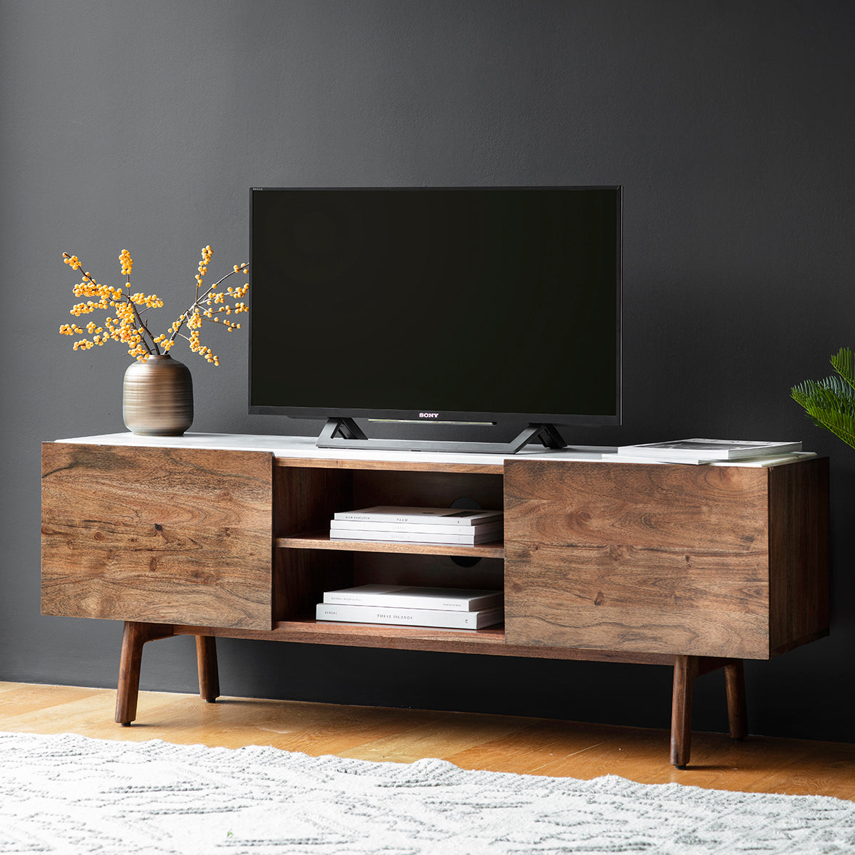 An Avonwick Media Cabinet 1360x380x500mm from Kikiathome.co.uk showcasing interior decor and home furniture with a tv on top.