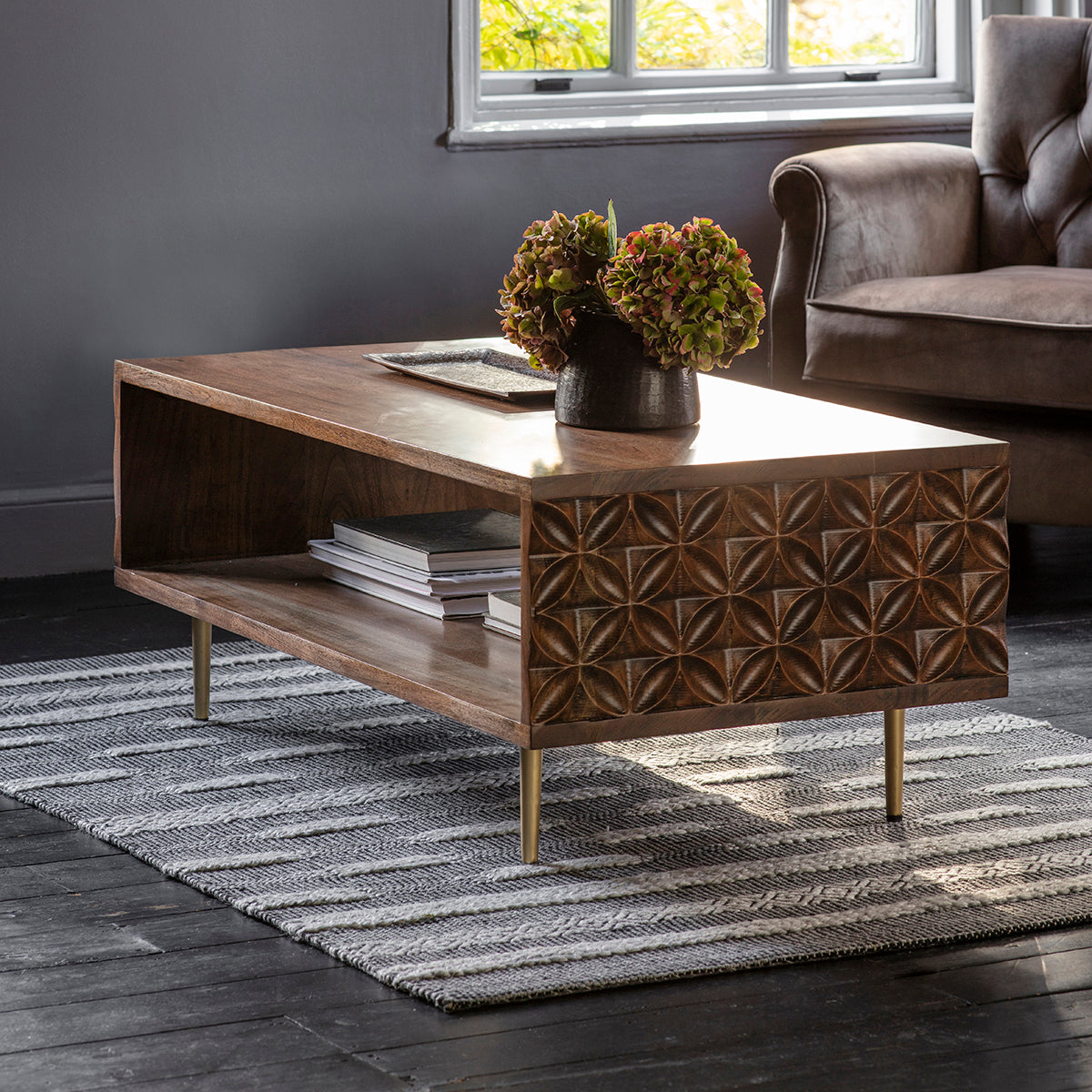 An interior decor centerpiece, the Ugborough Coffee Table by Kikiathome.co.uk adds style and functionality to a living room with a rug.