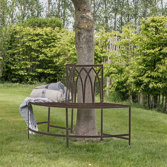 A Widecombe Outdoor Tree Bench Seat Ember for home furniture and interior decor.