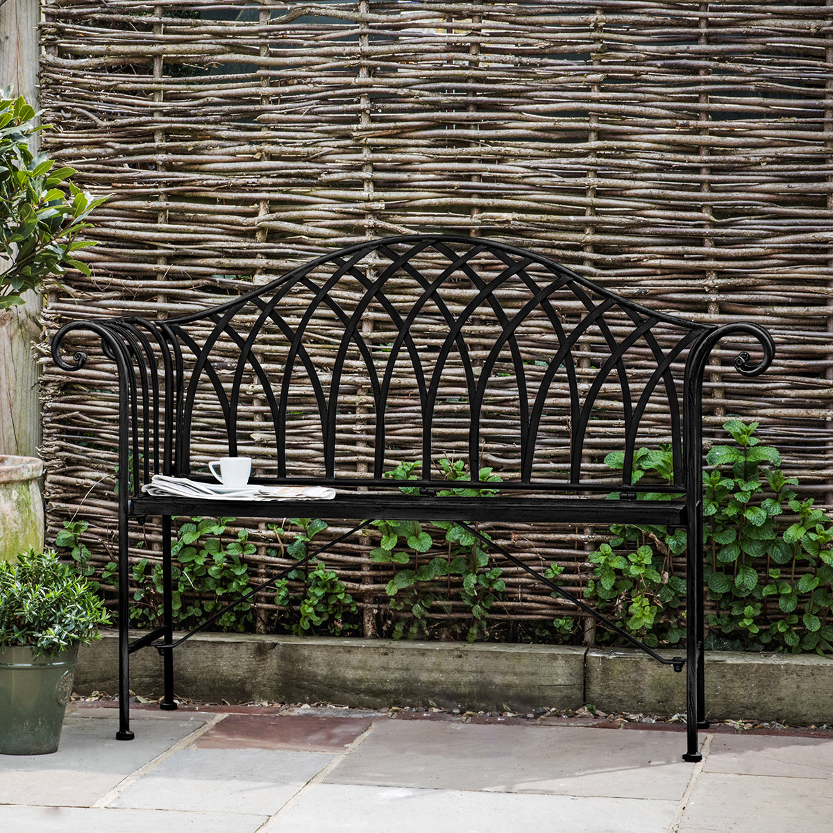 A Noss Outdoor Bench Noir by Kikiathome.co.uk enhances the garden with stylish home furniture.