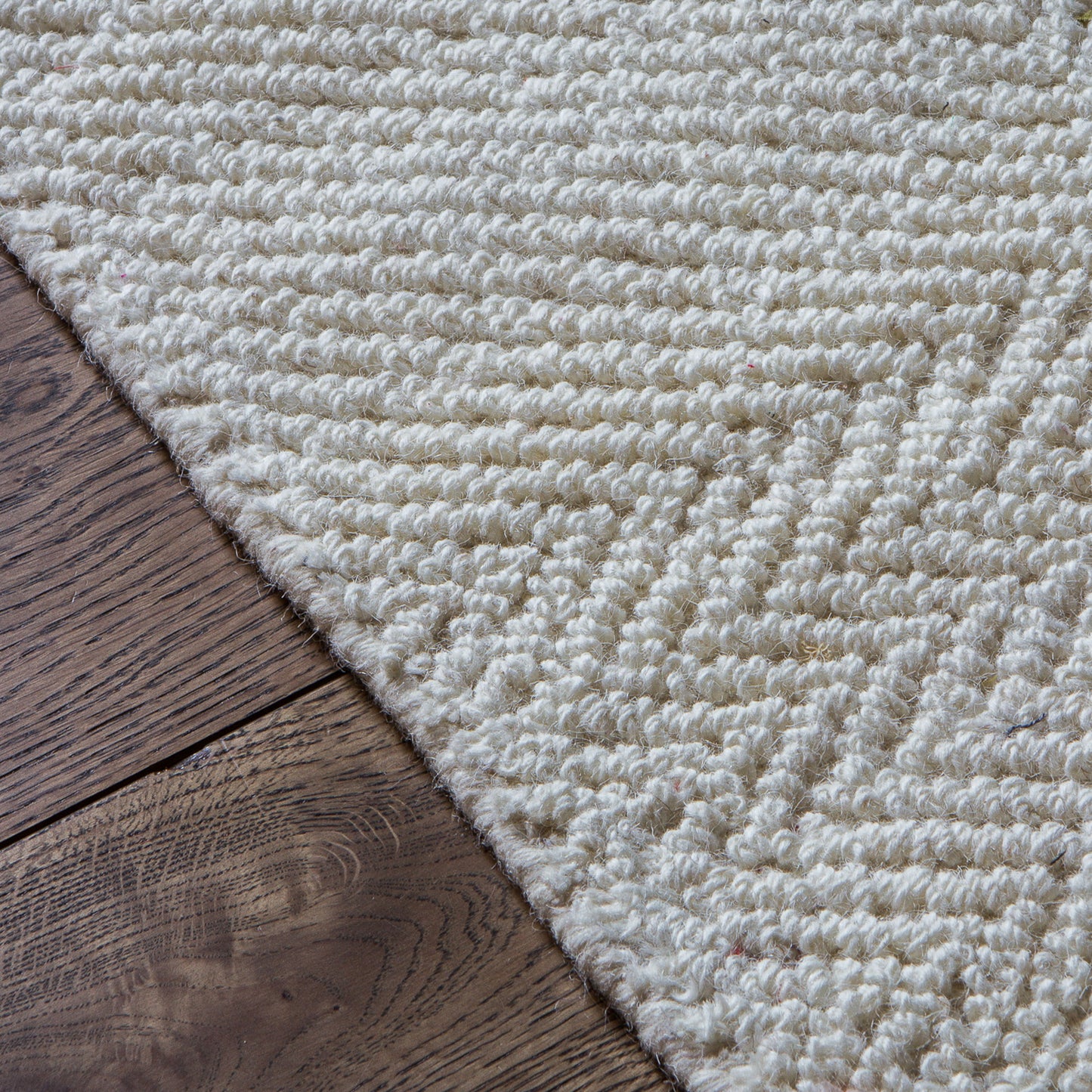 A Maydel Rug Cream 1600x2300mm, a home furniture, on a wooden floor from Kikiathome.co.uk.