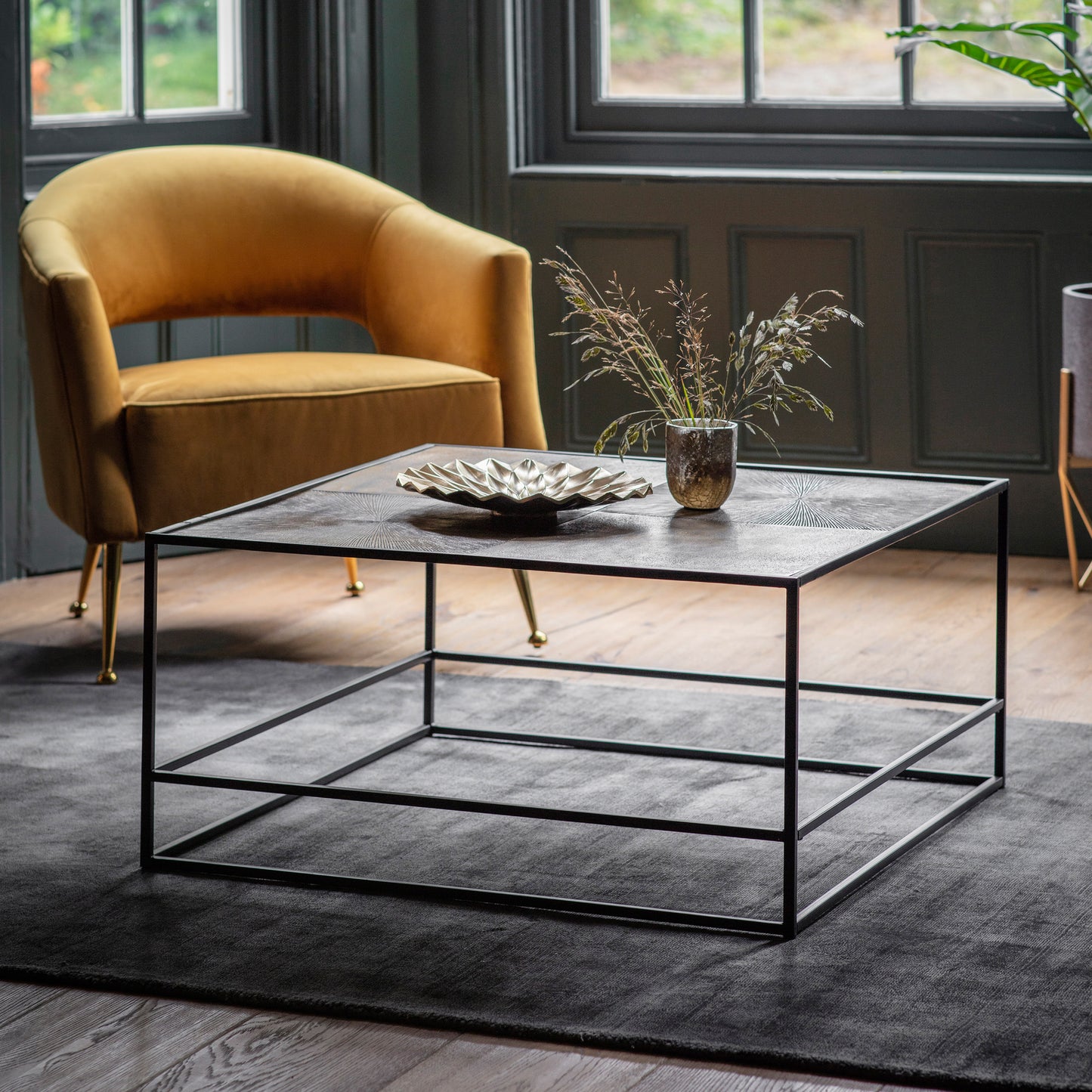 A Home furniture coffee table from Kikiathome.co.uk in a room with a yellow chair.