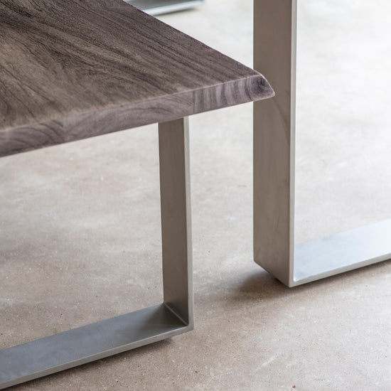 A Southpool Dining Bench Grey with a metal base and a wooden top, perfect for interior decor and home furniture.
