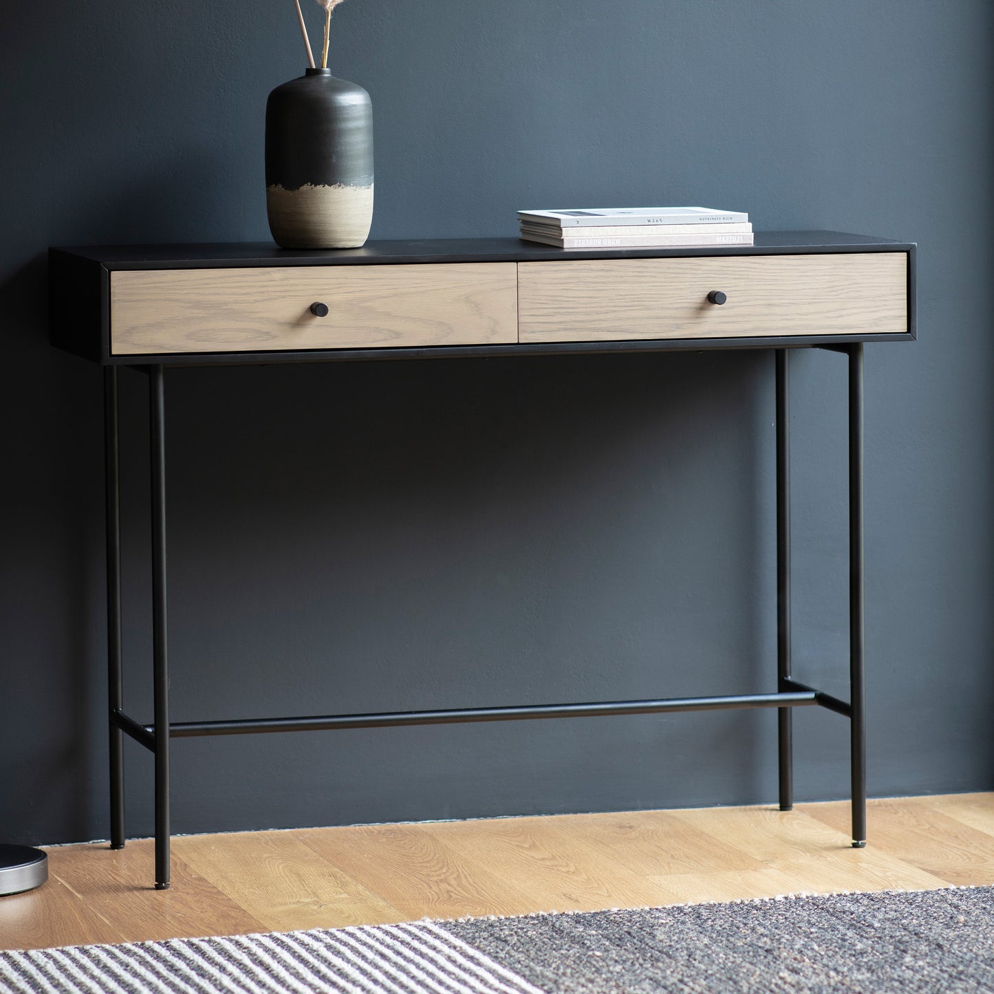 A Prawle 2 Drawer Console Table 1100x350x800mm from Kikiathome.co.uk, an interior decor piece with two drawers and a vase for home furniture.