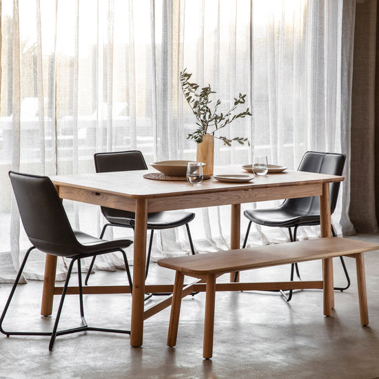 A Wembury Extendable Dining Table and chairs set for interior decor from Kikiathome.co.uk.