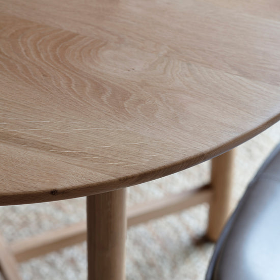 A close up of a Wembury Round Dining Table 900x900x750mm for interior decor.
