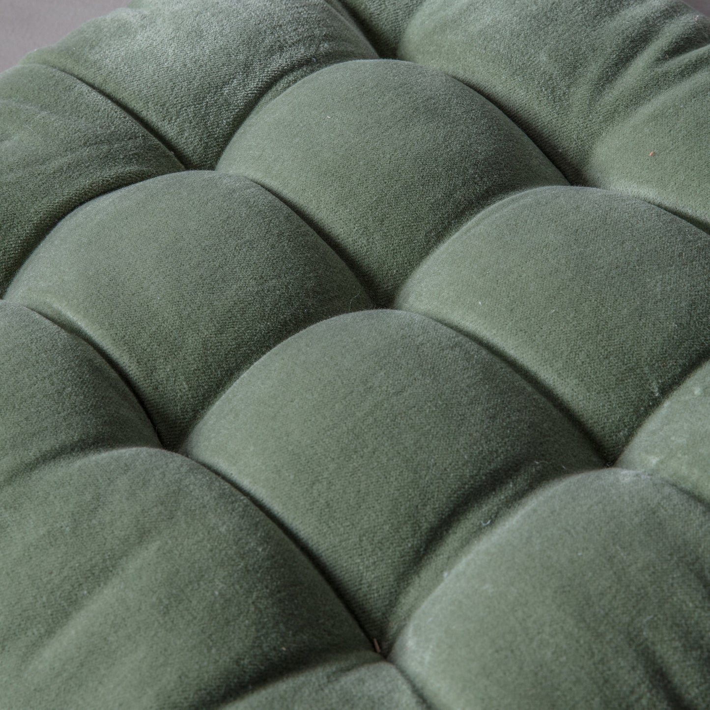 A close up of a cotton velvet seatpad cushion from Kikiathome.co.uk for interior decor.