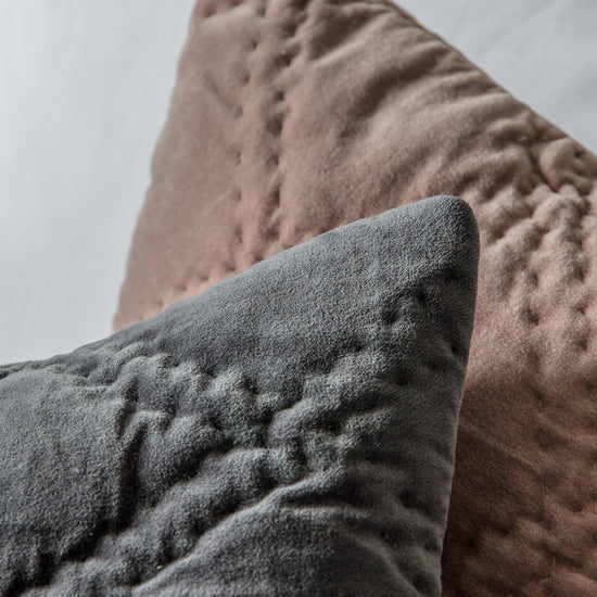 A close up of a Quilted Cotton Velvet Cushion Blush 450x450mm by Kikiathome.co.uk, an interior decor item.