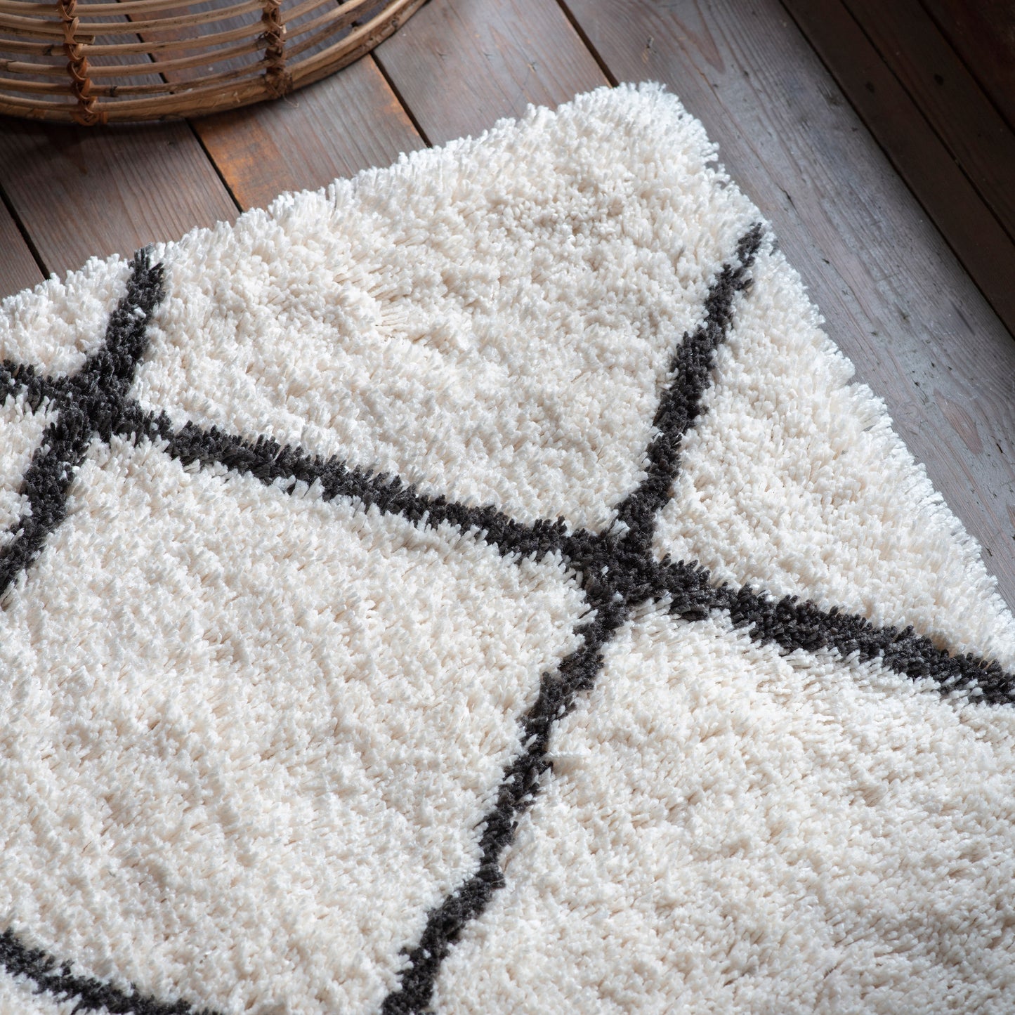 An interior decor rug from Kikiathome.co.uk enhances home furniture on a wooden floor.