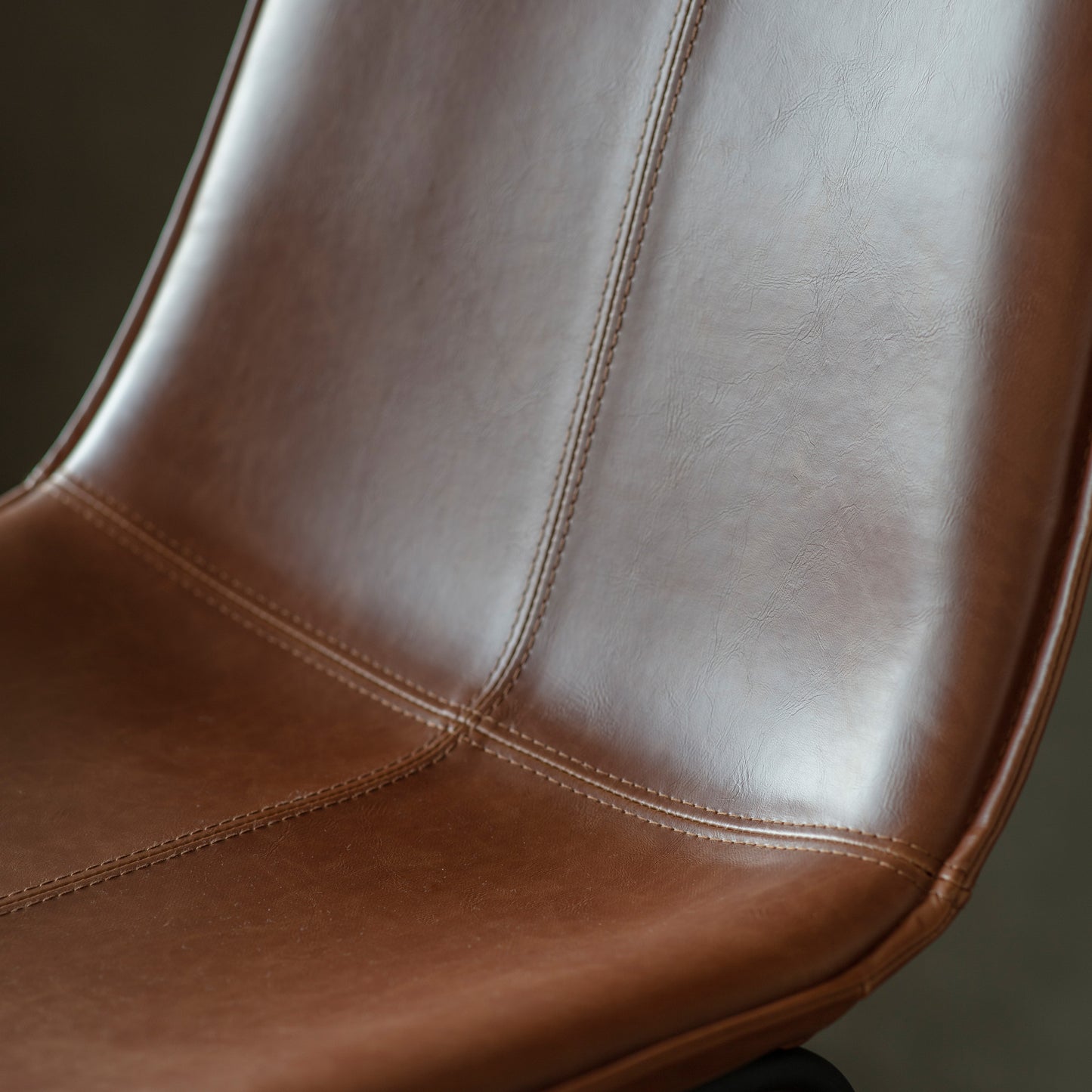 A close up of a Slapton Chair Brown (2pk) 490x550x860mm for interior decor.