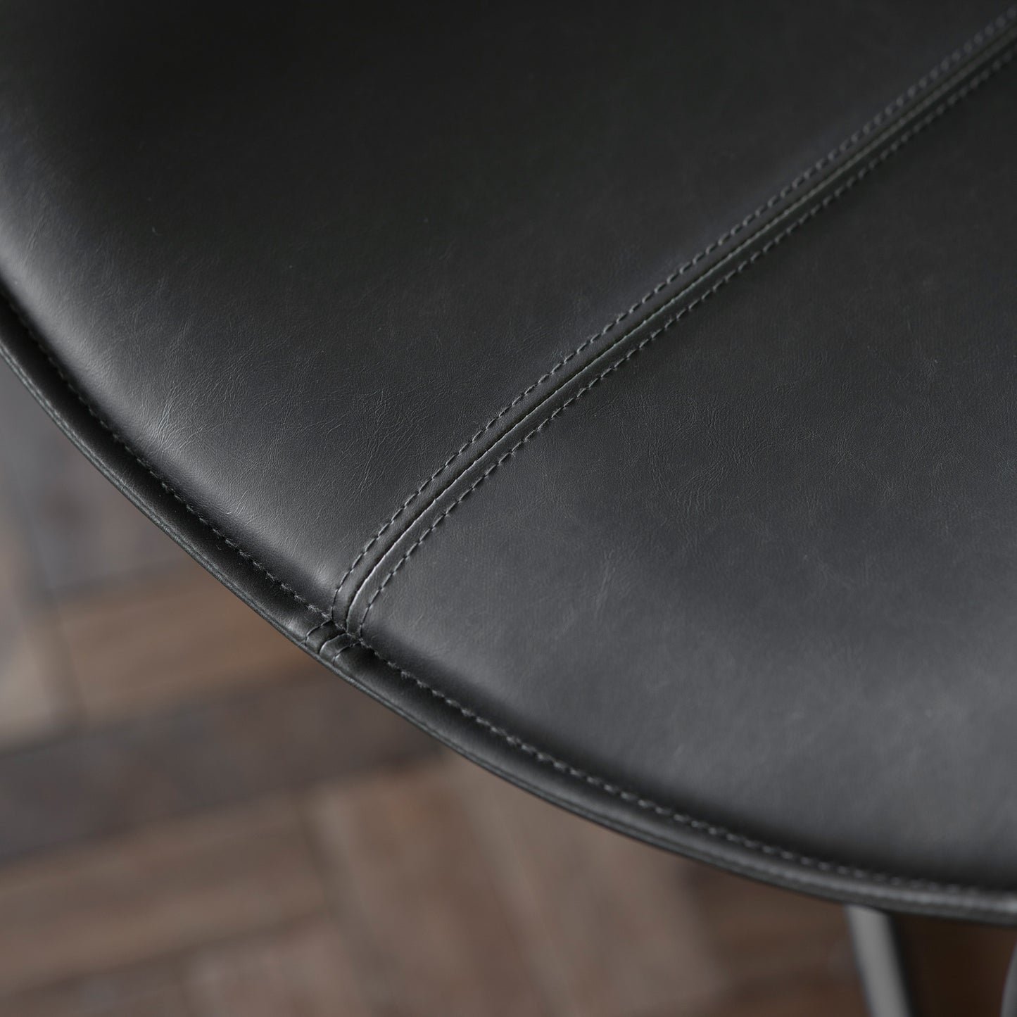 A close up of a black leather chair by Kikiathome.co.uk for home furniture and interior decor.