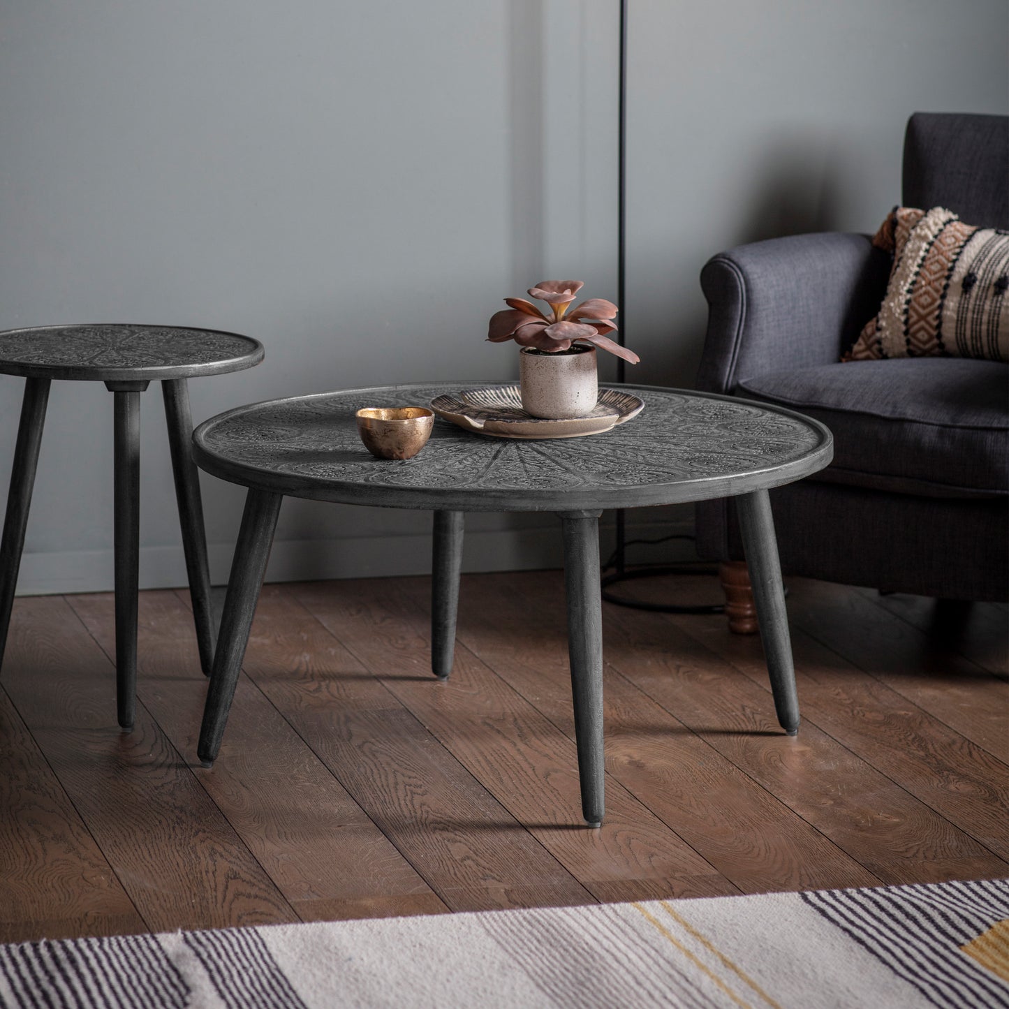A Bantham Coffee Table Grey Black 910x910x460mm and a side table, perfect for interior decor in a living room, from Kikiathome.co.uk.