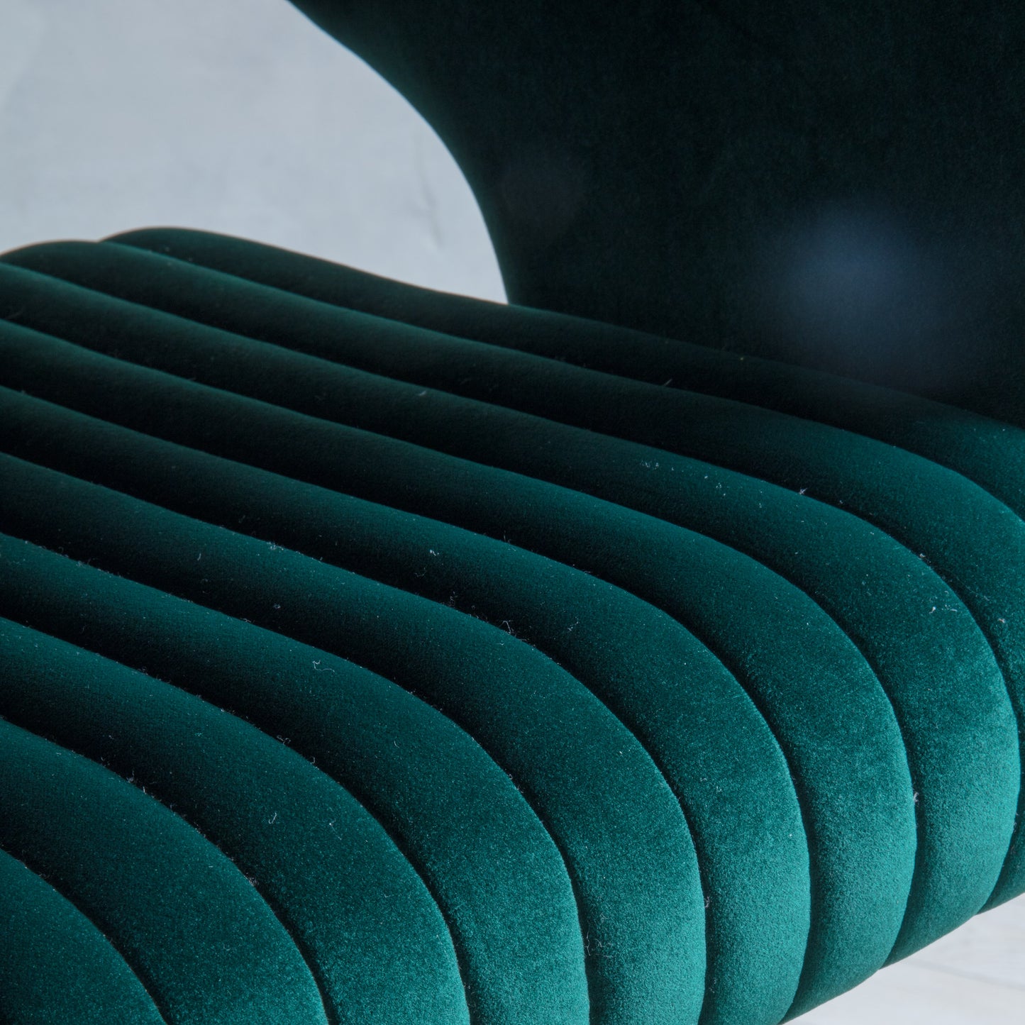 A close up of a Murray Swivel Chair Green Velvet from an online retailer specializing in interior decor and home furniture.