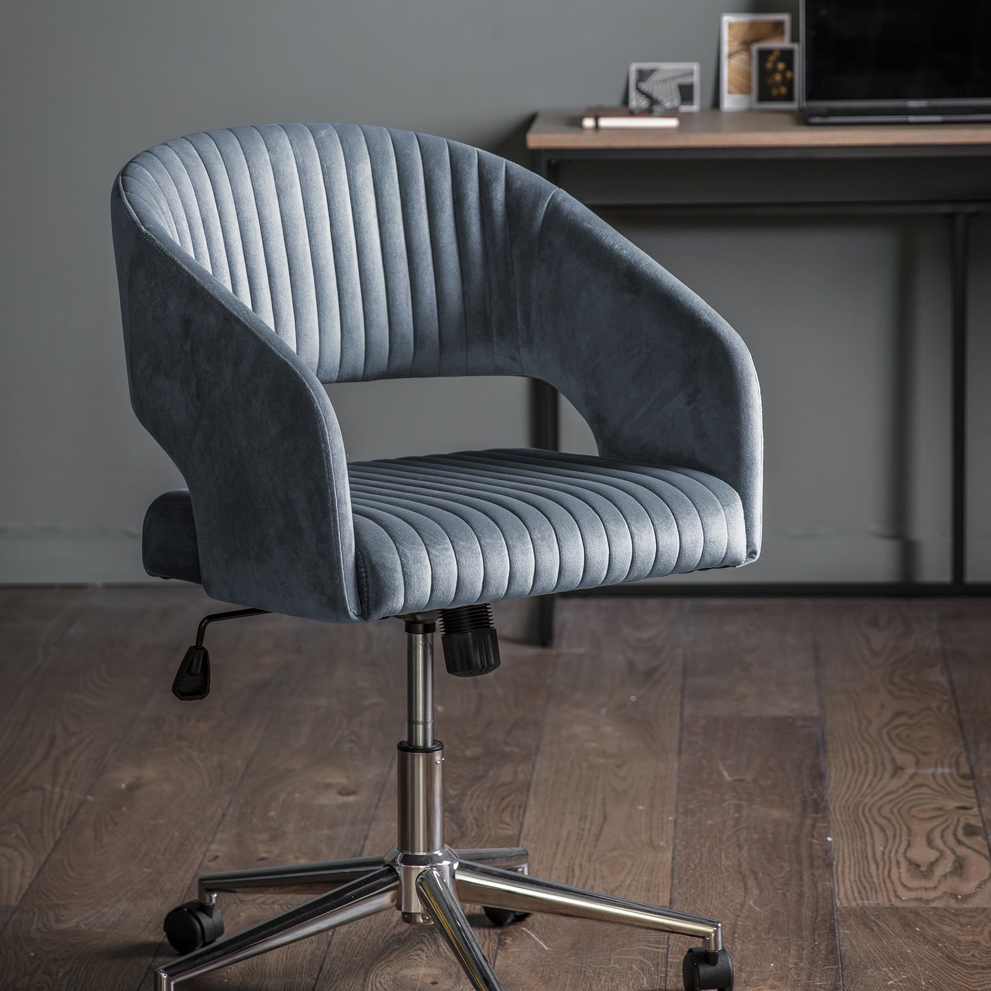 A Murray Swivel Chair in Charcoal Velvet, perfect for interior decor and home furniture.