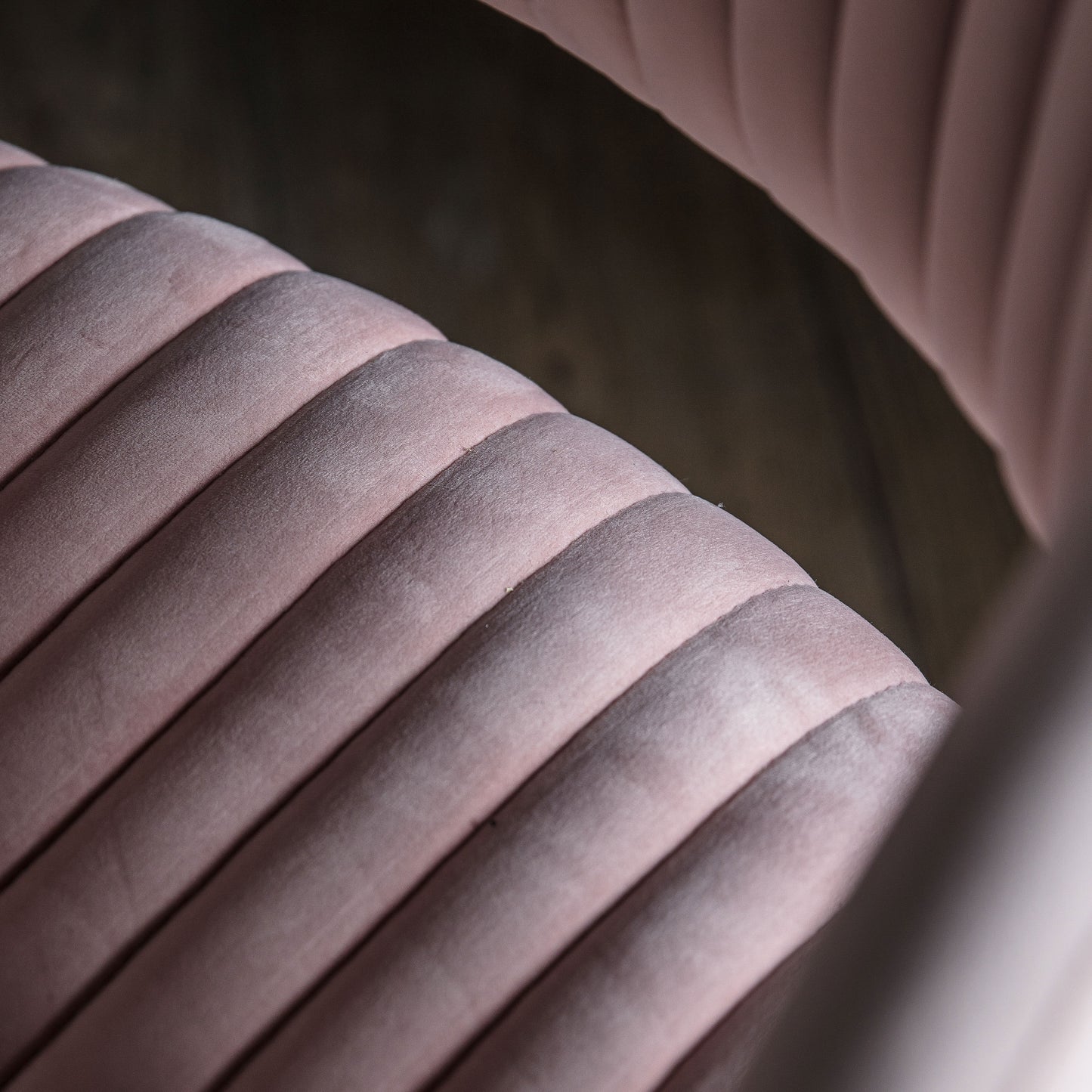 A close up of a Murray Swivel Chair Pink Velvet for home furniture from Kikiathome.co.uk.
