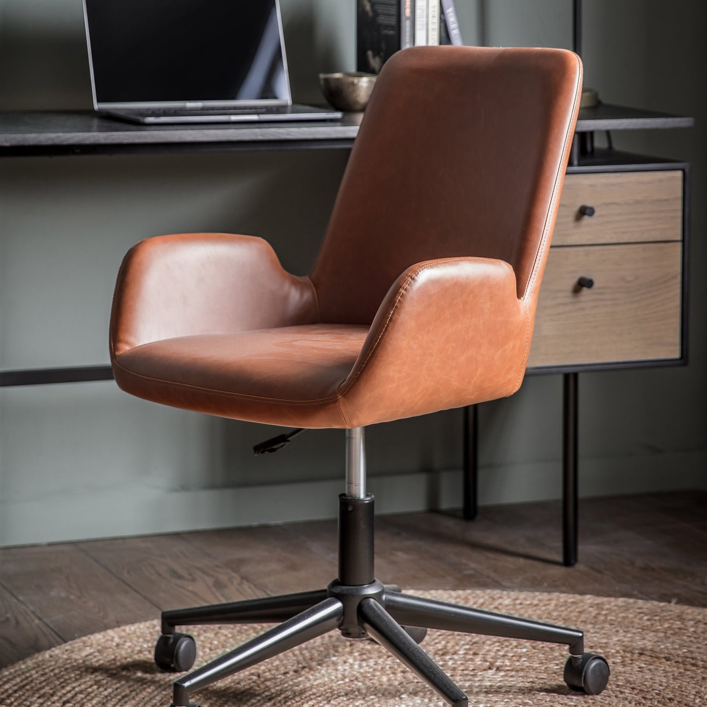 A Noss Swivel Chair Brown from Kikiathome.co.uk as a stylish addition to home furniture and interior decor.