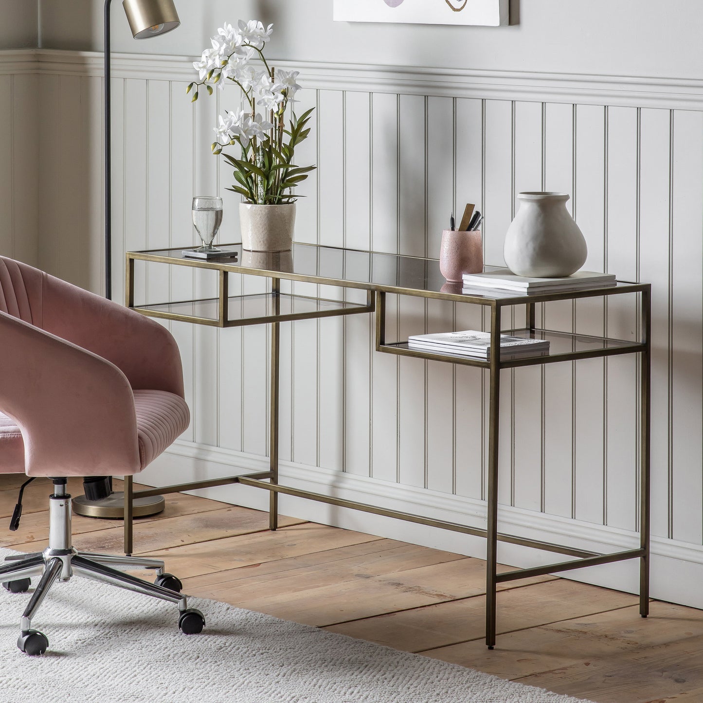 Interior decor: A pink chair and an Engleborne Desk Bronze 1300x500x760mm by Kikiathome.co.uk elegantly furnish a room with stylish home furniture.