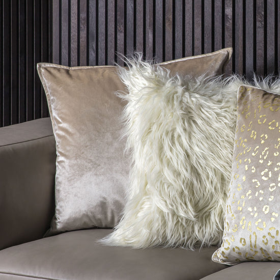 Two Meto Velvet Oxford Cushions Oyster 580x580mm adding elegance to the interior decor of a home furniture setup.