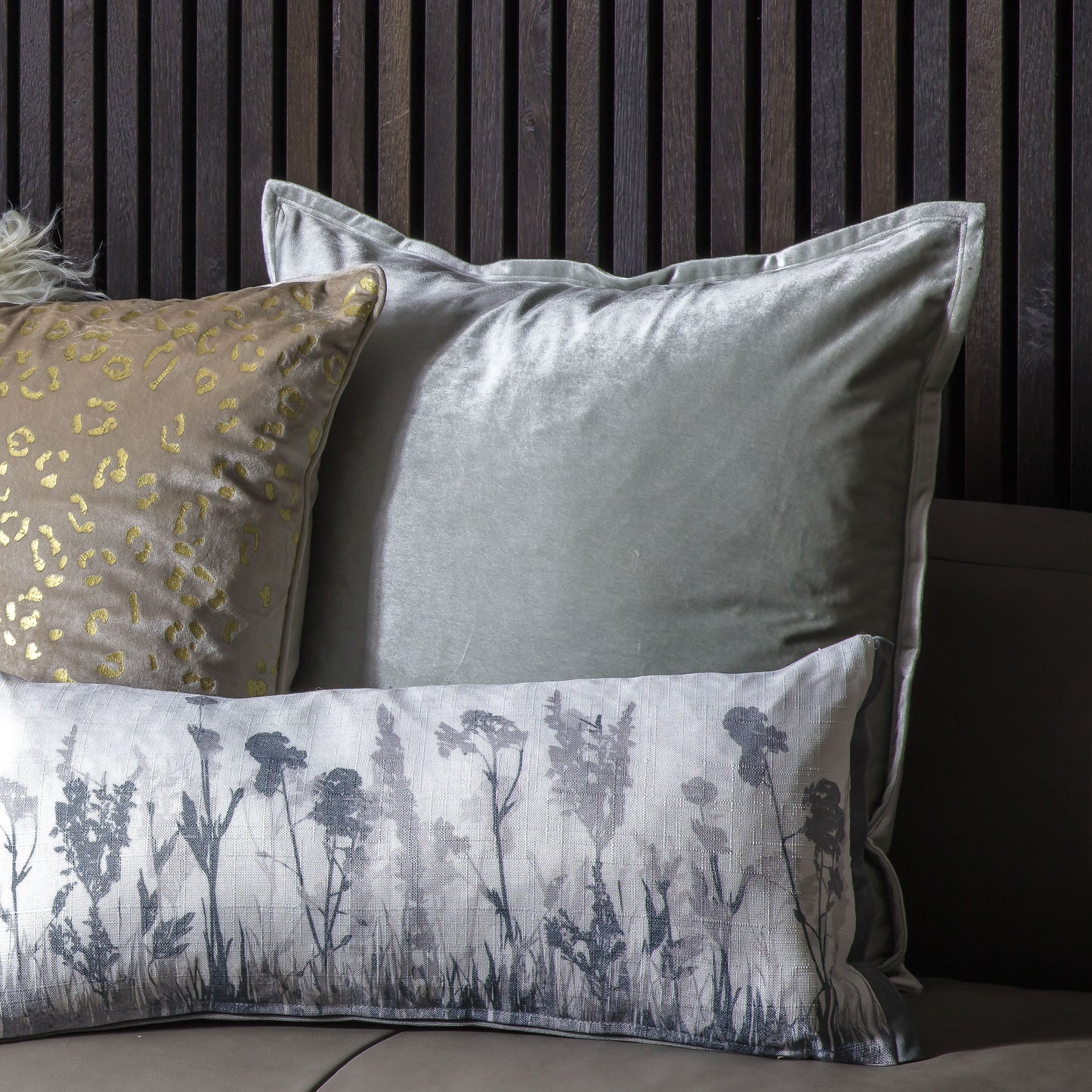A stylish sofa with Meto Velvet Oxford Cushion Silver 580x580mm cushions, perfect for interior decor and home furniture.