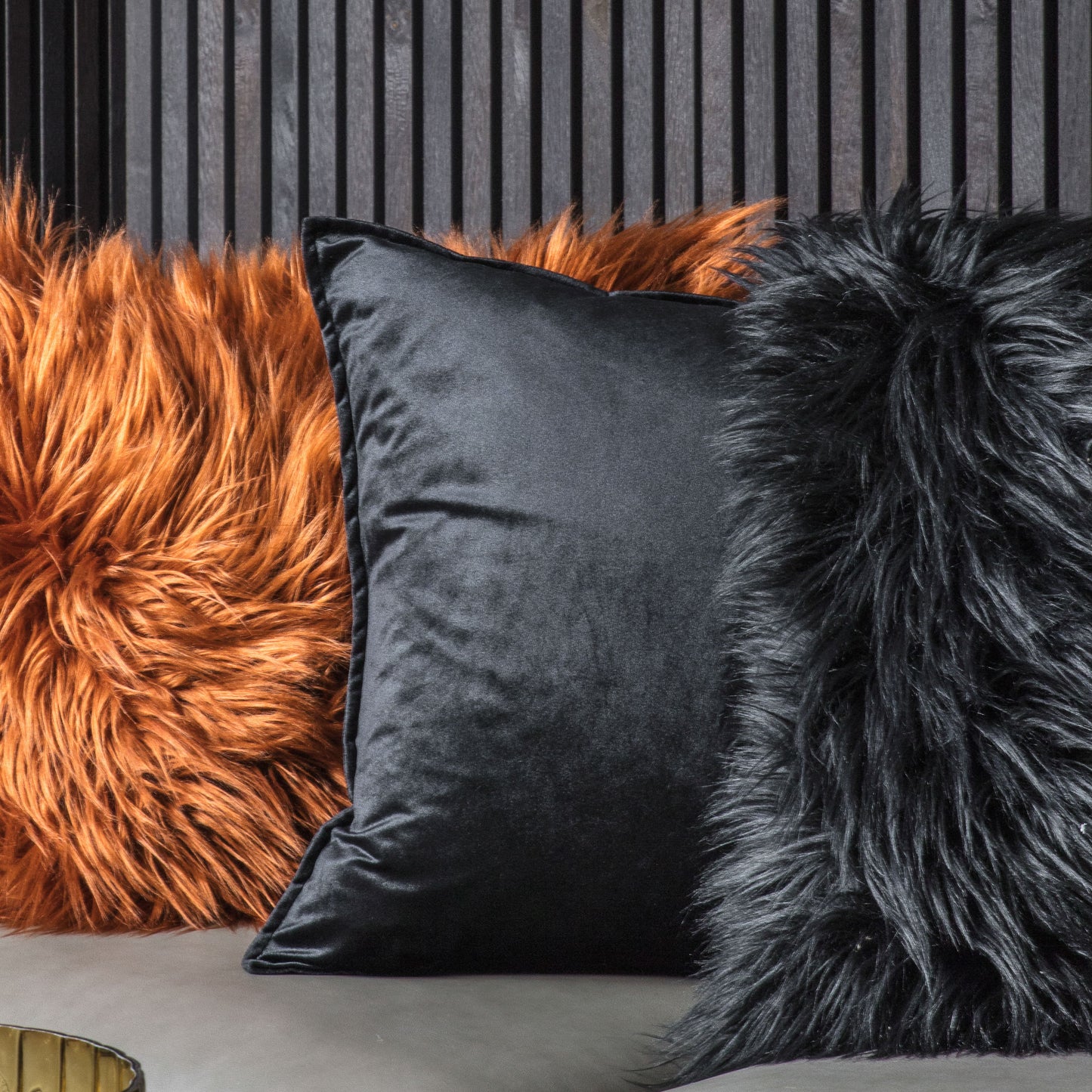 Meto Velvet Oxford Cushion in Black 580x580mm incorporates interior decor on a sofa.