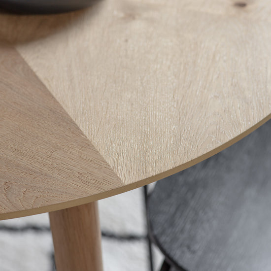 A close up of a Tristford Round Dining Table, an interior decor piece by Kikiathome.co.uk.