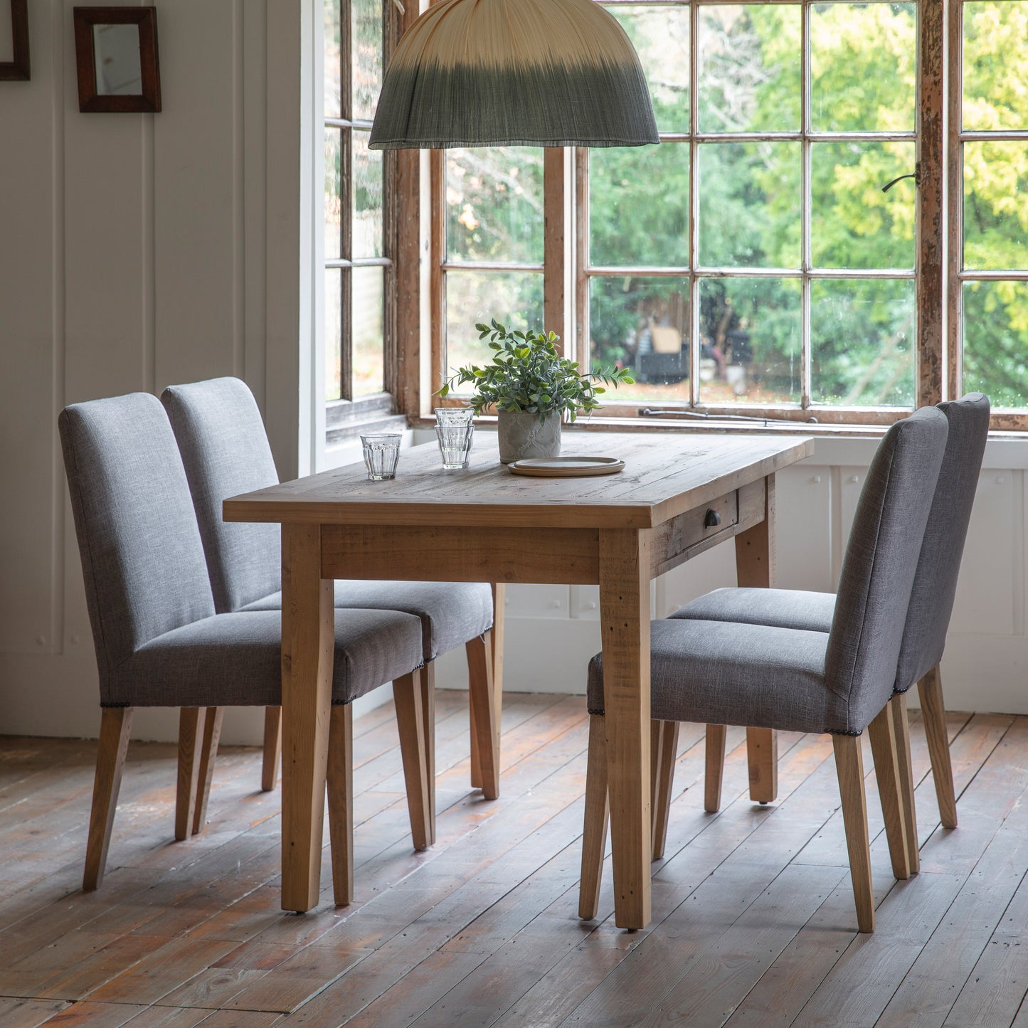 Load image into Gallery viewer, A dining room furnished with a Marldon 1 Drawer Dining Table and chairs from Kikiathome.co.uk, enhancing the interior decor with stylish home furniture.
