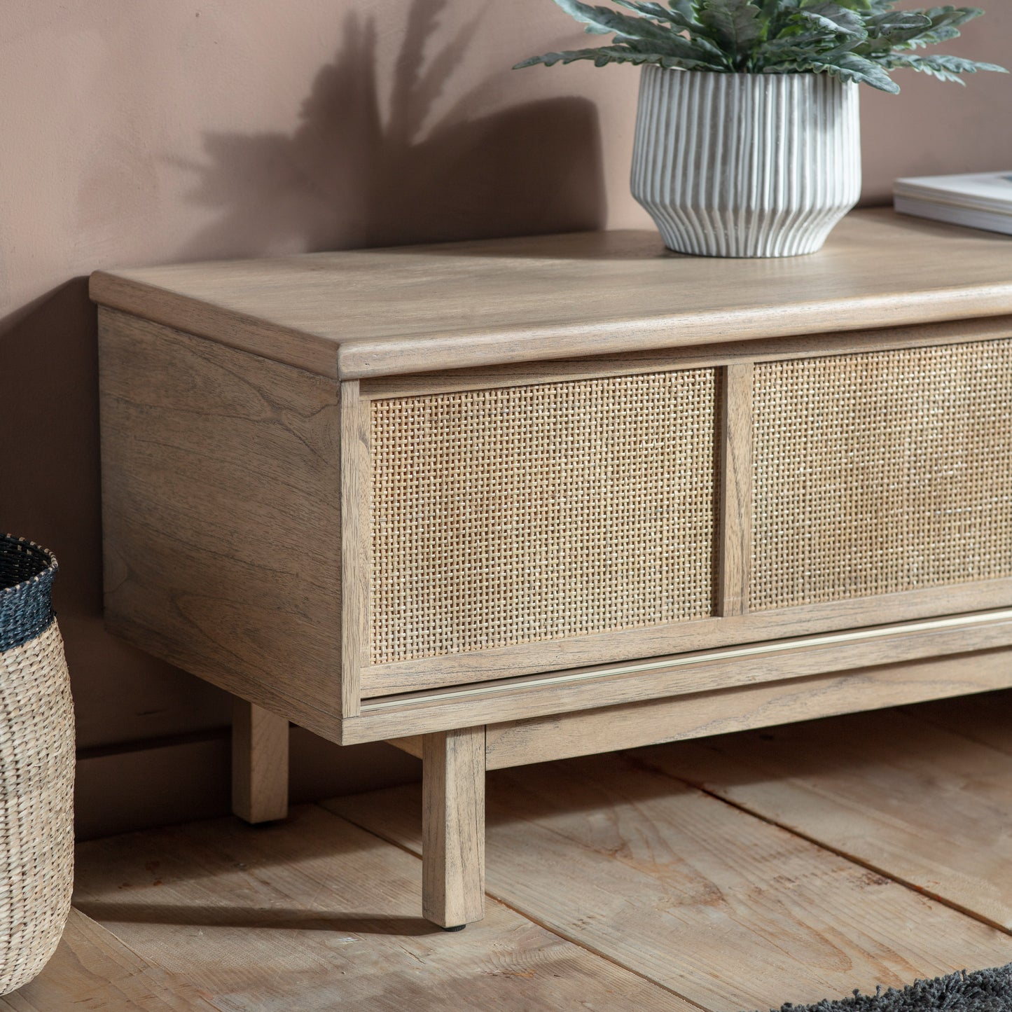 A home furniture media unit with a basket on top, available at Kikiathome.co.uk.