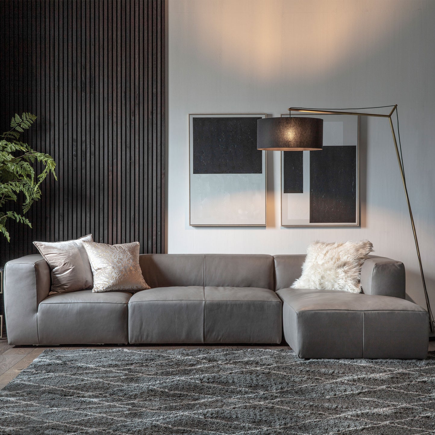 A modern living room with a Ravenna Corner Chaise Grey Leather sofa for stylish home furniture and interior decor.