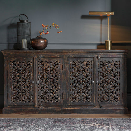 Load image into Gallery viewer, An ornate home furniture piece, the Chillington 4 Door Sideboard 1800x410x900mm by Kikiathome.co.uk, adds elegance to interior decor in a dark room
