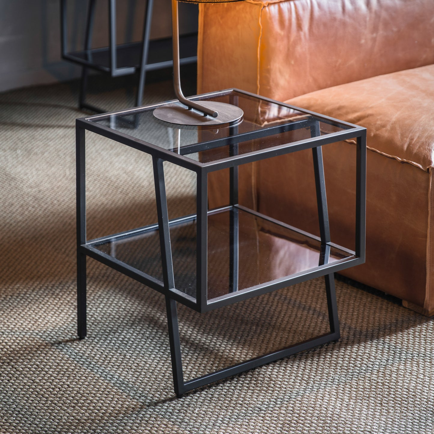 A Putney Side Table with glass top, perfect for interior decor.