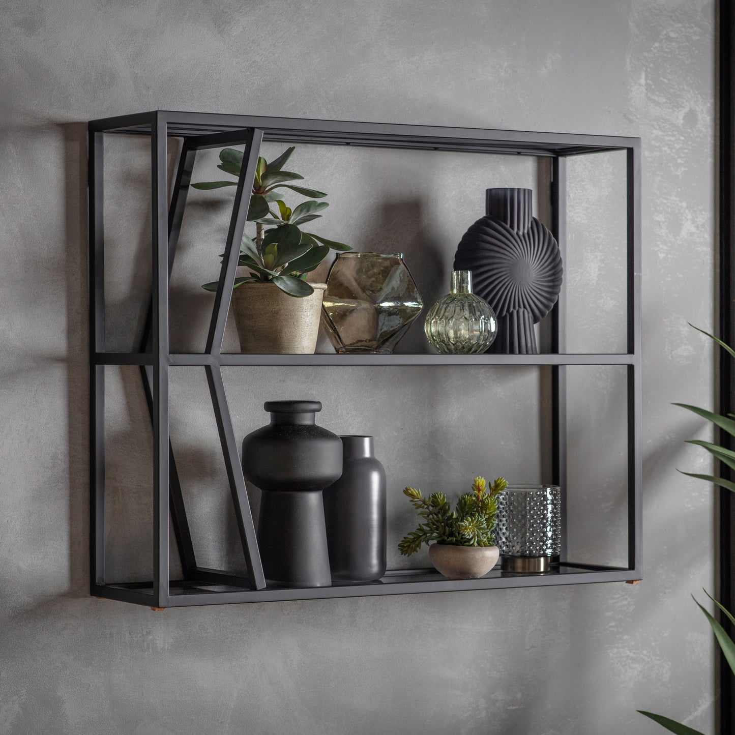 A stylish Putney shelf unit adorned with plants and pots, perfect for enhancing home furniture and interior decor.