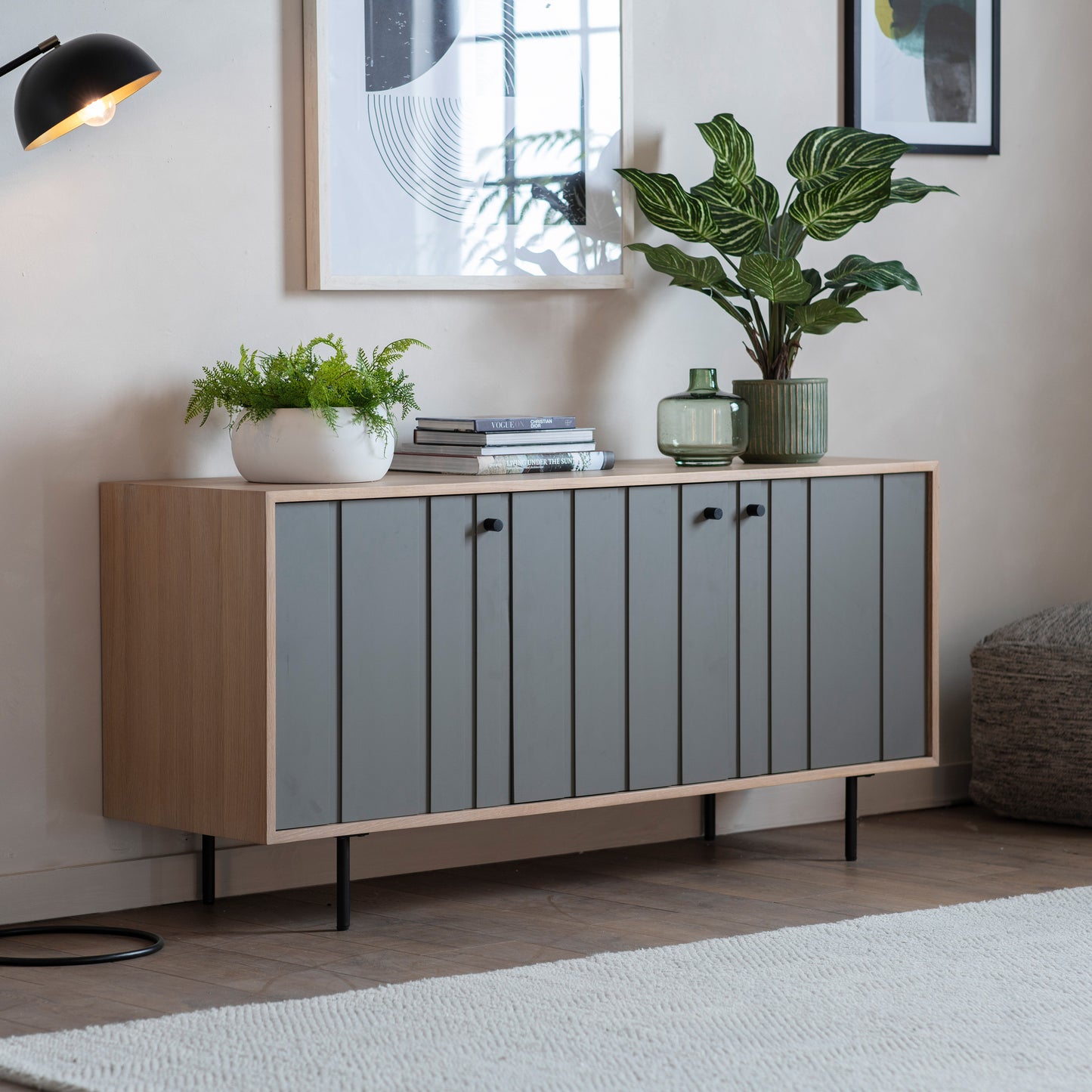 A Sparkwell 3 Door Sideboard 1500x450x700mm by Kikiathome.co.uk, a home furniture piece, enhances the interior decor of a living room with a plant