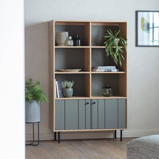 A stylish Sparkwell Open Display 1000x350x1600mm bookcase from Kikiathome.co.uk adds charm to interior decor in a living room.