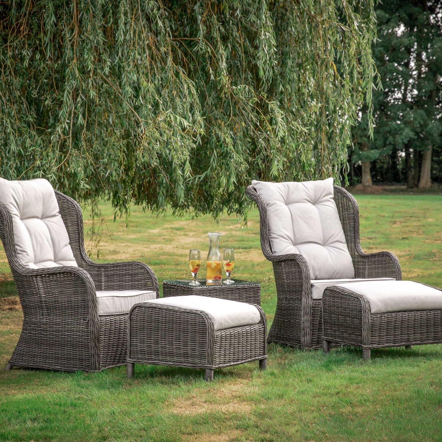 A set of high back lounge chairs in natural wicker, perfect for home furniture and interior decor.