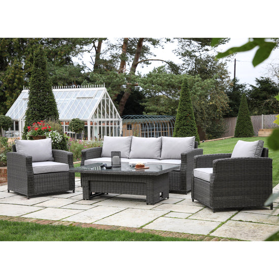Load image into Gallery viewer, A Bigbury 5 Seater Dining Set Rising Table Grey set from Kikiathome.co.uk in a garden, perfect for interior decor.

