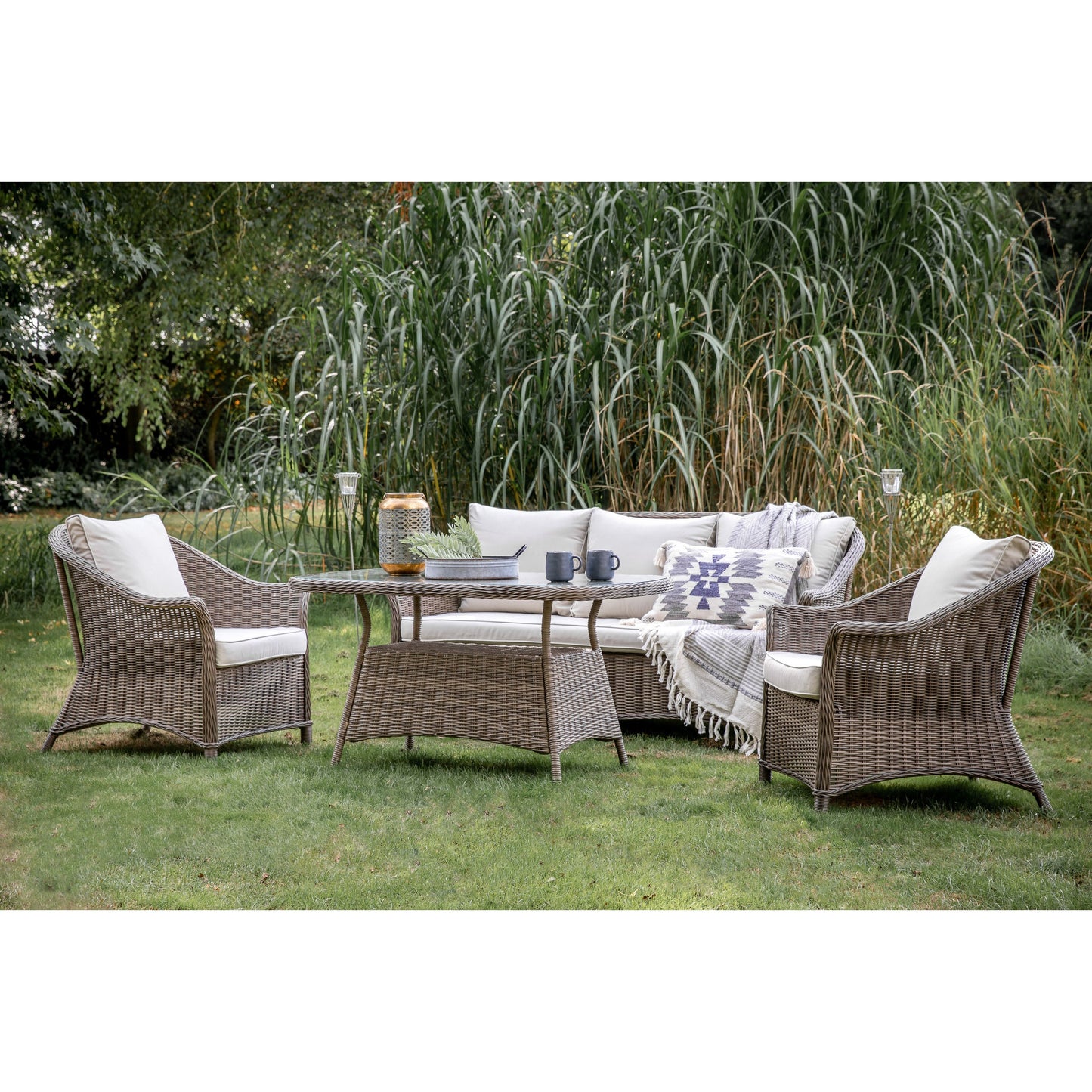 A Dartington Lounge Dining Set Natural for interior decor by Kikiathome.co.uk in a grassy area.