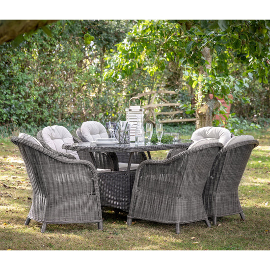 A Meavy 6 Seater Dining Set Grey from Kikiathome.co.uk, perfect for interior decor or home furniture, beautifully showcased in a garden.