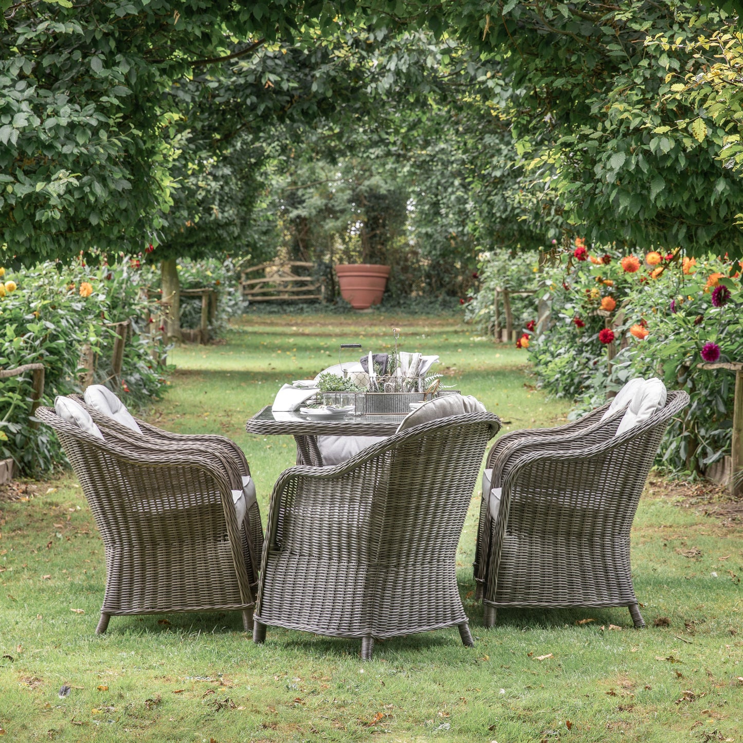 A Meavy 6 Seater Dining Set Natural by Kikiathome.co.uk enhancing the interior decor of a garden.