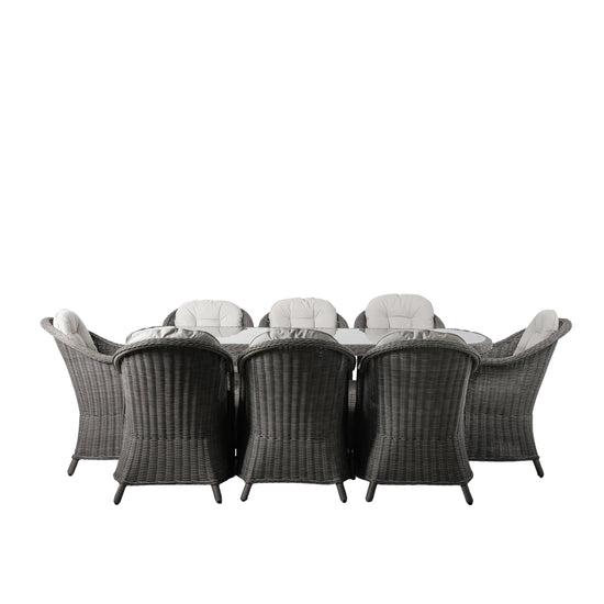A Meavy 8 Seater Dining Set Grey with six chairs for interior decor.