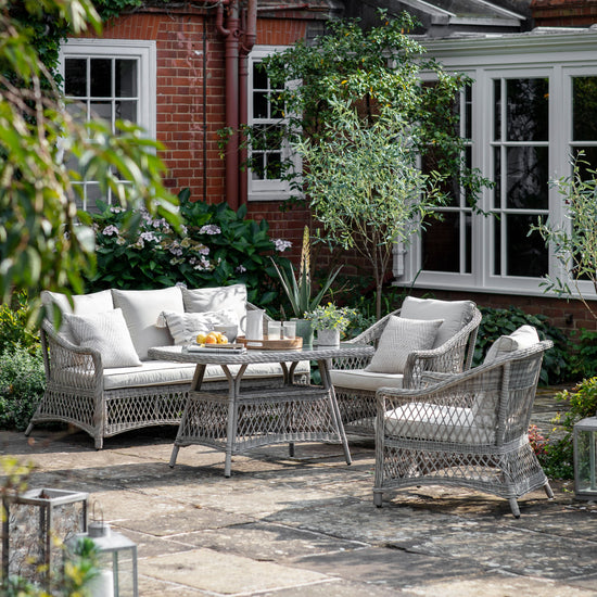 A Allington Country Sofa Dining/Tea Set Stone by Kikiathome.co.uk adorning a patio as outdoor home furniture.