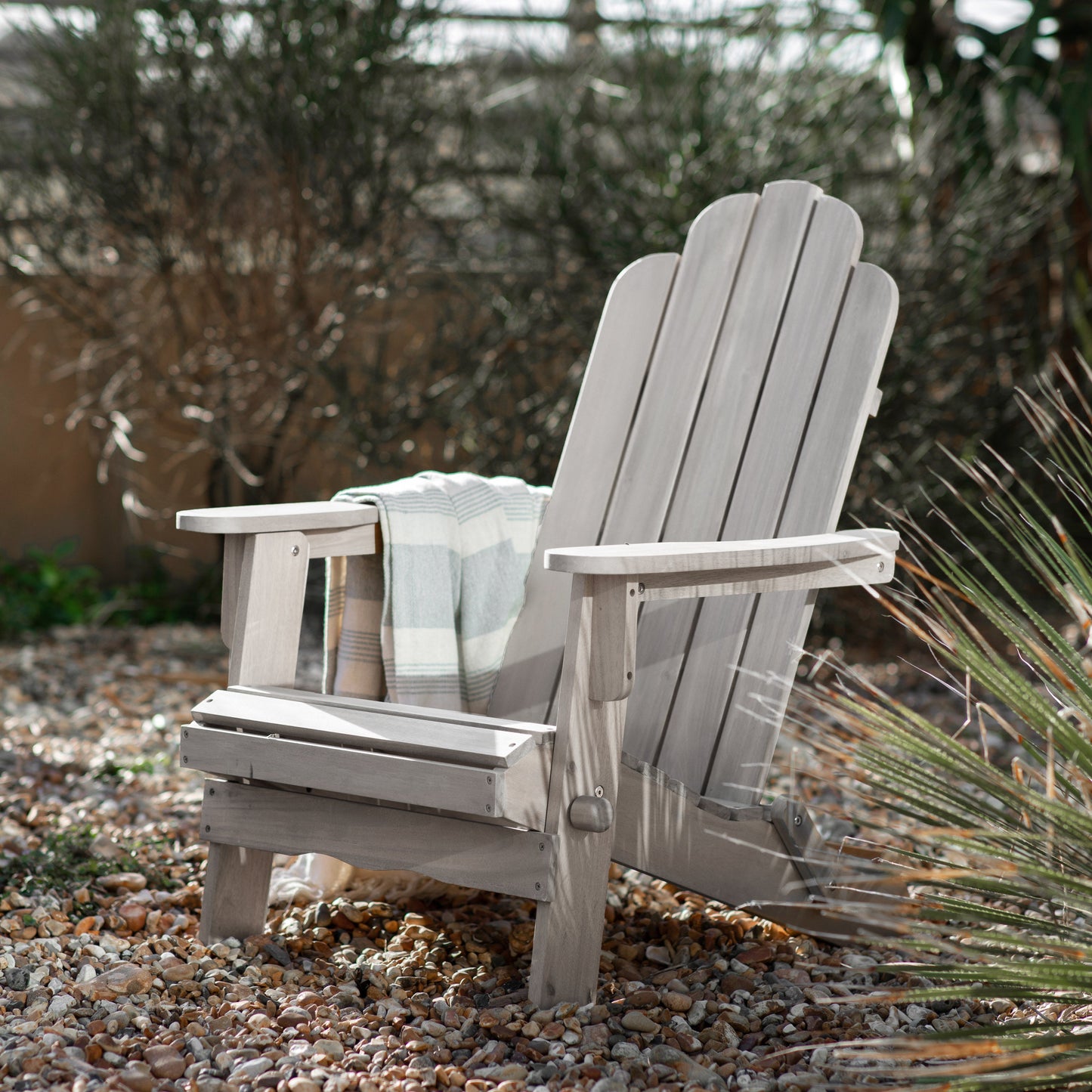 Load image into Gallery viewer, A Barley Lounge Chair by Kikiathome.co.uk, a whitewashed home furniture piece, situated in a garden for interior decor.
