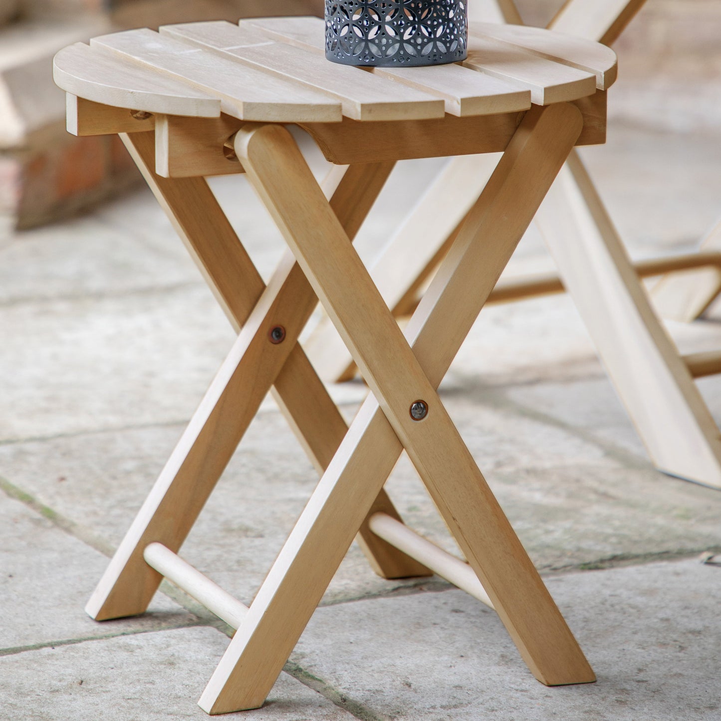 A Chillington Side Table, part of the home furniture collection at Kikiathome.co.uk, complements interior decor beautifully with a candle adorning its surface.
