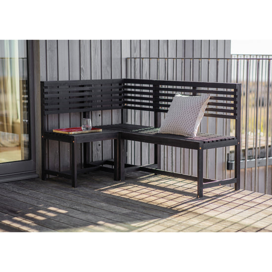 A black Alfrington Balcony Modular Bench Charcoal on a wooden deck, perfect for interior decor from Kikiathome.co.uk.