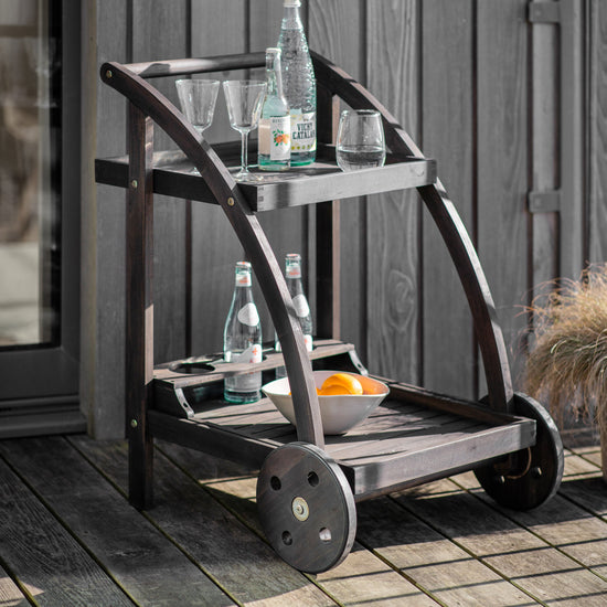 A black Alfrington drinks trolley by Kikiathome.co.uk adds sophistication to the interior decor of a home.