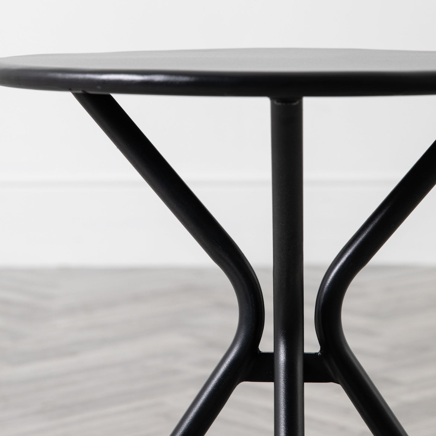 A Kikiathome.co.uk round side table adds style to interior decor as home furniture on a wooden floor.