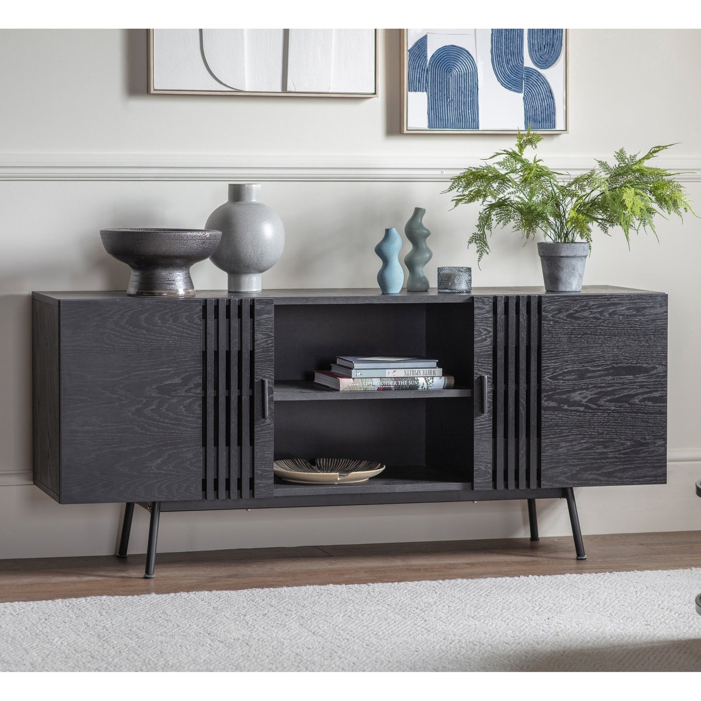A Black Holston Sideboard with shelves and a vase on top for interior decor.