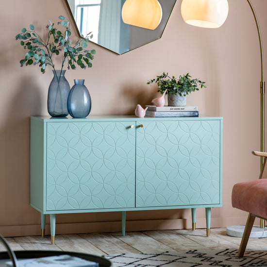 Load image into Gallery viewer, A pink and green living room with a Thurlestone 2 Door Cabinet Mint 1200x400x790mm from Kikiathome.co.uk and a mirror, showcasing stylish home furniture and
