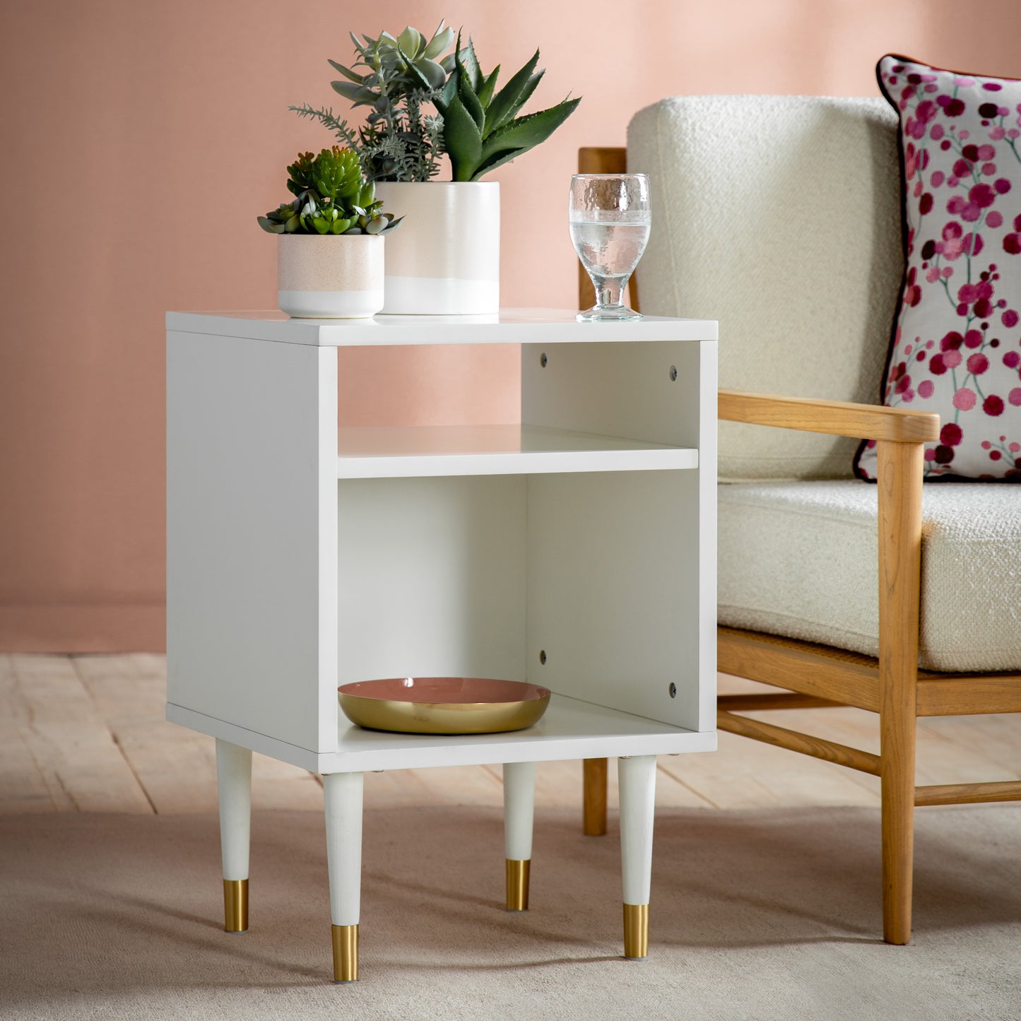 Interior decor: A Thurlestone Side Table White 400x400x600mm from Kikiathome.co.uk adds a stylish touch to any interior space, complemented by a chair and a